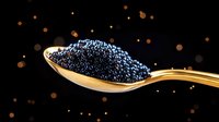 Black caviar on golden spoon against dark background with glowing bokeh lights creates luxurious food composition for gourmet and fine dining concepts.