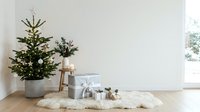 Decorated evergreen tree with wrapped gifts and natural decor on wooden floor near window, suitable for holiday and seasonal home interior design projects.