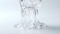 Clear liquid water splashing and dripping down isolated on white background, suitable for beverage, refreshment, and product design applications.