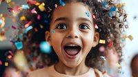 Excited African American child with curly hair expressing pure joy and wonder as colorful confetti falls around, capturing authentic emotion and celebration moment.