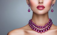 Elegant woman wearing luxurious purple pearl necklace and matching drop earrings with pink lipstick against gray background, cropped beauty portrait for jewelry advertising.