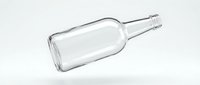 Empty clear glass bottle with screw cap lying on white surface, suitable for beverage packaging, product mockups, and commercial advertising designs.