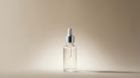 Clear glass dropper bottle with silver cap on neutral beige background for skincare serum cosmetic product photography and beauty branding design.