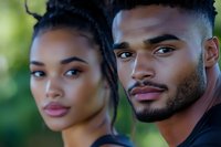 Young African American couple portrait with natural lighting and soft focus background for lifestyle and relationship concepts.