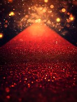 Red glittering path with magical bokeh lights and sparkles against dark background creates dreamy atmosphere for festive or romantic designs.