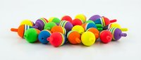 Colorful spinning tops with striped patterns in vibrant hues arranged in a group on white background, suitable for toy marketing and children's product catalogs.