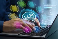 Businessman using laptop with LLM artificial intelligence brain hologram and colorful data processing icons for machine learning technology applications.