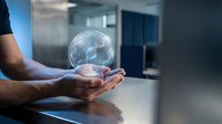 Businessman holding glowing digital globe with network connections in modern office environment representing global business technology and connectivity.