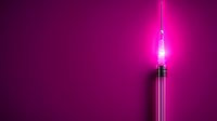 Glowing pink neon tube light against dark purple background creates modern minimalist composition with strong vertical line and bright illumination.
