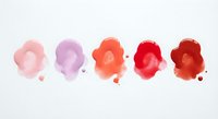 Watercolor paint drops in pink red orange gradient with splashes on white paper background for artistic design projects.
