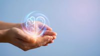 Hands holding glowing brain hologram against sky background, representing artificial intelligence, innovation, technology, and digital transformation in modern business and science.