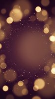 Abstract golden bokeh lights on dark purple background with sparkling particles creating magical atmosphere for luxury design projects.