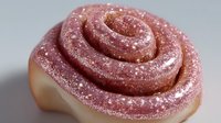 Pink sugar-coated spiral cinnamon roll pastry with sparkling crystalline coating on neutral background for bakery and dessert marketing materials.