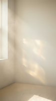 Minimalist beige corner room with warm sunlight streaming through window creating soft shadows on neutral walls for modern interior design backgrounds.