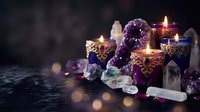 Mystical altar setup with burning candles, amethyst crystals, and gemstones creating spiritual atmosphere for meditation, healing rituals, and esoteric practices.