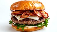 Juicy beef burger with crispy bacon strips, melted cheese, fresh arugula on toasted brioche bun against white background, food photography.