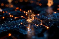 Glowing bitcoin symbol on digital circuit board with orange light connections and bokeh effects creating futuristic cryptocurrency concept background.