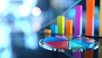 Colorful business charts and graphs showing financial growth with pie chart and bar graph on blurred blue bokeh background for financial analysis.