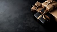 Elegant gift boxes wrapped in black and brown paper with satin ribbons and bows arranged on dark textured background with copy space for holiday designs.