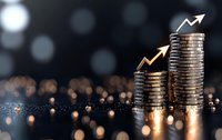 Growing stacks of silver coins with upward trending arrows on dark background with bokeh lights, representing financial growth and investment success.