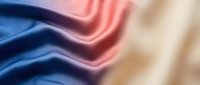 Smooth fabric textures in blue, pink, and cream tones with soft folds and waves, suitable for backgrounds, design projects, and textile presentations.