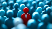 Red figure standing out among blue crowd representing leadership, uniqueness, individuality and business distinction in corporate environment.