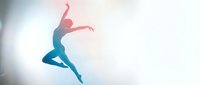 Young athletic woman dancer jumping in mid-air with graceful pose against bright white background, expressing freedom and movement in contemporary dance style.