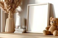 Mockup frame with teddy bear, pampas grass in ceramic vase and books on wooden shelf with natural sunlight and shadows. Cozy home interior styling.