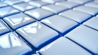 Geometric pattern of white glossy cubes with blue lighting effect creating modern technological background with diagonal perspective and selective focus.