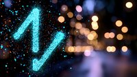 Glowing blue neon letter N with sparkle effect against blurred bokeh lights background creates magical nighttime atmosphere for design projects and party invitations.