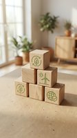Wooden blocks with green eco symbols stacked in pyramid formation on natural surface in bright modern interior with plants for sustainable business concepts.
