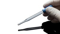 Close-up of gloved hand holding laboratory pipette tip with blue cap against white background for scientific research and medical testing applications.