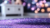 Purple glitter scattered on dark surface with soft bokeh lights in background creates magical festive atmosphere for holiday designs and celebrations.