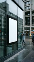 Blank white billboard mockup at modern glass bus stop on busy urban street with pedestrians walking by for advertising campaign display.