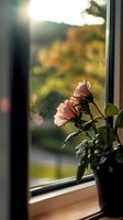 Pink roses in pot on windowsill at sunset, soft natural lighting creates dreamy atmosphere with bokeh background and dust particles catching golden light.