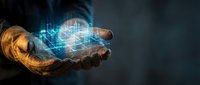 Hands holding glowing digital hologram with circuit board pattern and data visualization, representing technology innovation and future computing solutions.