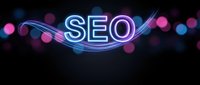Glowing neon SEO text with colorful bokeh lights on dark background for digital marketing and search engine optimization concepts.