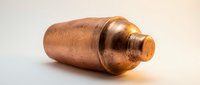 Copper pipe fitting with threaded connection isolated on white background for plumbing and construction projects.