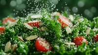 Fresh kale salad with cherry tomatoes and sliced almonds sprinkled with water droplets against dark background, macro food photography.
