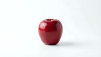 Glossy red apple isolated on white background, ready for design use on packaging, marketing materials, and educational content.
