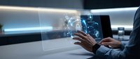 Businessman interacting with holographic digital interface displaying data visualization and technology elements in modern workspace environment.