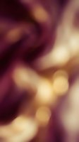 Soft bokeh background with warm golden and deep burgundy tones creating an elegant, out-of-focus atmosphere suitable for overlays, backdrops, and design projects.