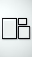 Three black picture frames with white mats arranged on a light wall, gallery wall mockup for art prints and poster display.