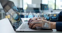 Professional accountant working on laptop with digital tax management interface displaying financial icons and percentage symbols for business taxation services.