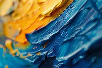Abstract artistic macro photography of oil paint texture showing vibrant blue and yellow colors merging together, perfect for creative backgrounds and modern art designs.