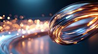 Glowing spiral light trails with golden and blue streaks against dark background with bokeh effect create dynamic motion and energy flow for technology designs.