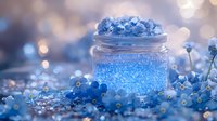 Magical glowing jar with blue sparkles surrounded by delicate forget-me-not flowers on blurred bokeh background, creating dreamy atmosphere.