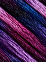 Diagonal stripes pattern in vibrant pink, purple, and blue colors with textured fiber effect creates dynamic movement and depth for modern design backgrounds.