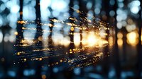 Glowing fiber optic cables with sparkling light effects and bokeh background for technology and communication concepts.