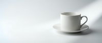 White ceramic cup and saucer on isolated background, ready for beverage mockups, cafe branding, and product design applications.